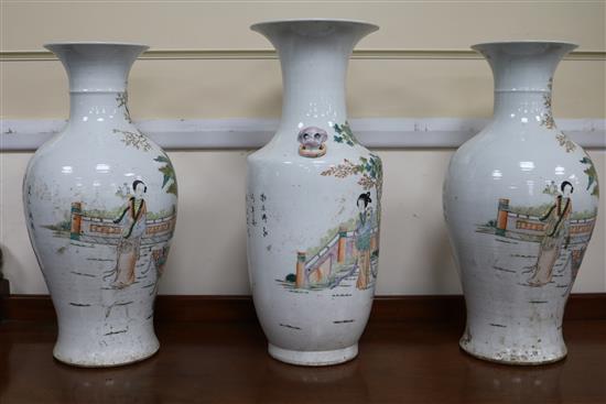 A pair of vases and one other